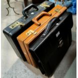 Two leather attache cases; etc.