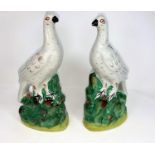 A 19th century pair of Staffordshire figures of pigeons, height 26