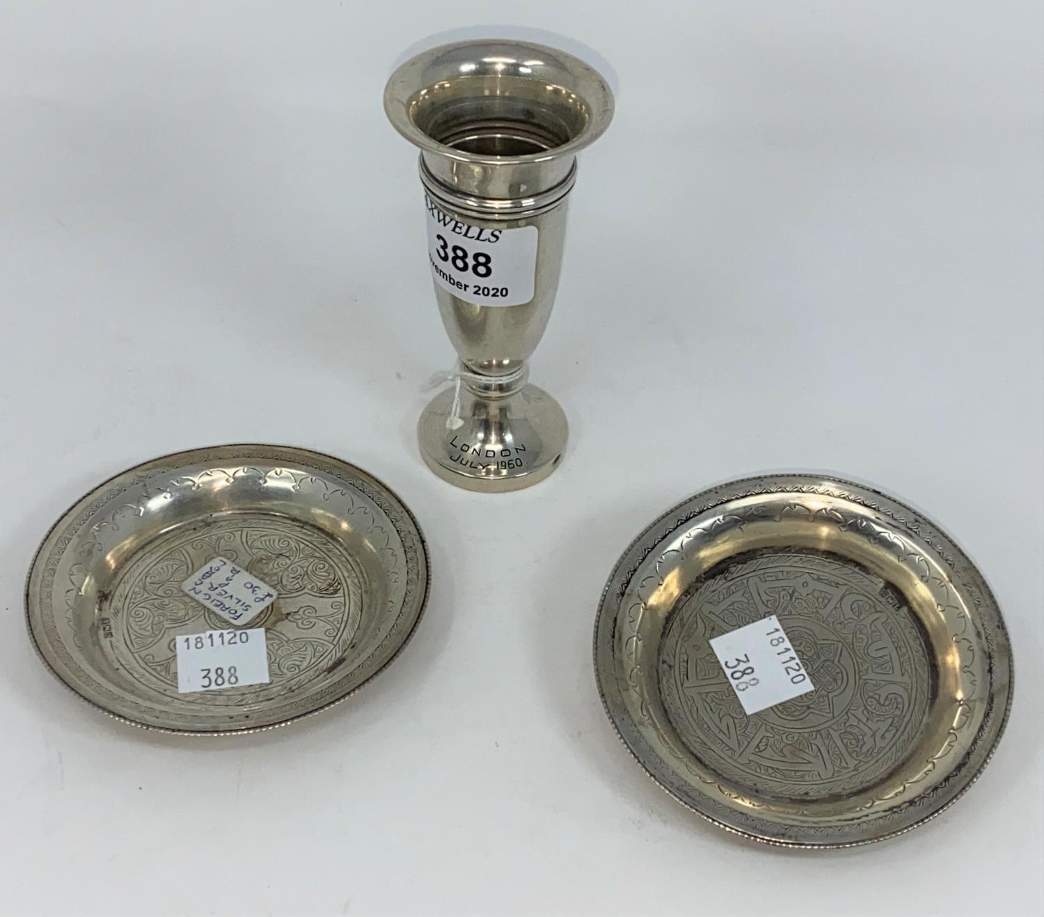 A small silver vase; a silver ring tree; silver top bottles; etc., various dates; 2 Middle Eastern