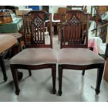 A set of six mahogany dining chairs on tapering legs