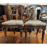 A Victorian set of 4 mahogany dining chairs with balloon backs
