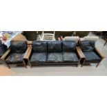 A Danish rosewood framed lounge suite comprising 3 seater settee and 2 armchairs