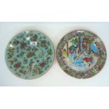 A Chinese pair of shallow dishes in the famille verte manner on celadon ground, diameter 25 cm