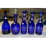 A modern set of 3 decanters, overlaid blue; 2 similar decanters