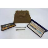 A meerschaum cigar holder with silver mounts; a silver cigar piercer; a silver propelling pencil;