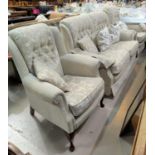 A 2 piece lounge suite comprising 2 seater settee and armchair