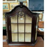 A mahogany wall hanging display cabinet, period style with arch top