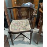 An Edwardian inlaid corner armchair