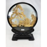 A Chinese cork picture in circular glazed stand