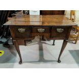 An 18th Century Country made Oak low boy with three drawers on cabriole legs