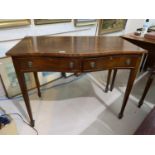 A reproduction mahogany side table in the Regency style with serpentine front, fitted 2 drawers