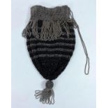 A drawstring purse with faceted cut steel and French jet beads