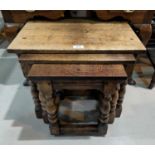 A period style nest of occasional tables in distressed oak