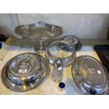 A silver plated covered entree dish of circular gadrooned form; a similar oval dish (no handle);