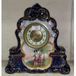 A 19th century mantel clock with French movement, in ornate china case with vignette of Charles I