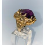 A large yellow metal naturalistic form ring set with large irregular shape amethyst, stamped 9ct,