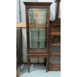 A stained wood display cabinet on turned legs, 53 cm