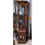 A Japanese display cabinet in high gloss lacquer finish with cupboard below, height 194 cm