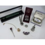 A selection of white metal items: an aide memoire; pill box; Celtic brooch etc.