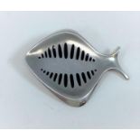 A Georg Jensen brooch designed by Hennig Koppel, amodernist fish with black enamel markings,