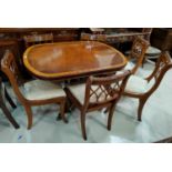 A Regency style crossbanded mahogany dining suite comprising single pedestal extending table and 6