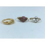 Two 18 carat gem set dress rings, 4.1gm; a 9 carat gem set dress ring, 1.3 gm