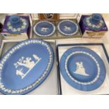 Two blue Wedgwood dishes, 2 smaller dishes and a pair of candle holders