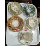 A selection of cabinet cups and saucers