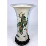 A Chinese famille vert flared rim vase on wooden stand (restored)