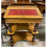 A Victorian inlaid walnut writing desk with slope front, leather inset flap, and 2 open shelves
