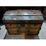 A dome top cabin trunk