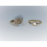 A 9 carat gold dress ring set 29 diamond chips, approx, stamped '375'; a 9 carat gold ring set clear