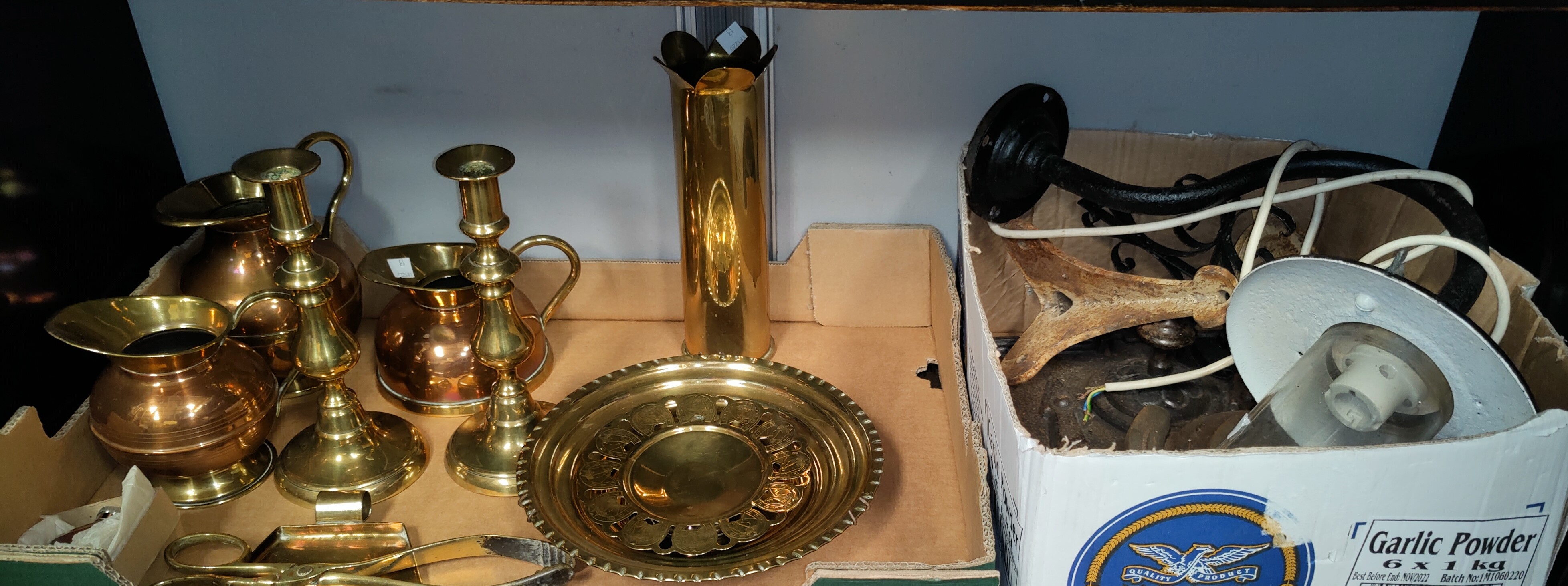 A brass shell casing, other trench art and horse shoes