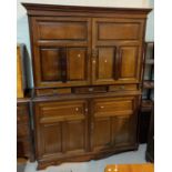 A late Victorian/Edwardian mahogany housekeepers linen cupboard with 8 short and and 3 long trays