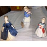 Two Royal Doulton figures: The Rag Doll & Debbie; a Nao figure: girl with cake and dog