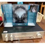 A vintage Luxman amp and a set of Sennheiser high end headphones
