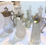 A Victorian style claret jug; 2 others; 6 decanters