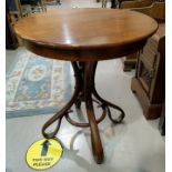 A bentwood occasional table with circular top
