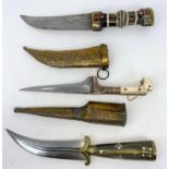 Three Middle Eastern ceremonial decorative knives with inlaid brass work etc