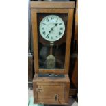 An early 20th century clocking-in clock in oak case, "The Gledhill-Brook Time Recorder Ltd"