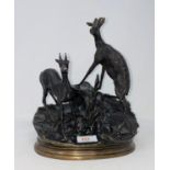 After Moigniez: modern animalier bronze of goats on a rocky surface, on oval gilt base, height 30 cm
