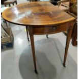 A Pembroke table in satinwood crossbanded figured mahogany, with oval top