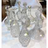 Ten various cut glass decanters