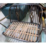 An Ercol 2 seater settee and armchair in dark stain, with stick backs (frames only)