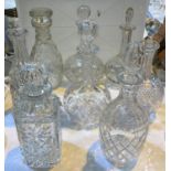Eight various cut glass decanters