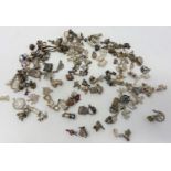A box of loose silver charms 520g. Approx 150 charms
