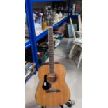 An Alvarez steel strung (strung left handed) acoustic guitar with stand & tuner