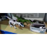 Two remote controlled reticulated dinosaur toys "Robotyrannus", one white, one green