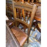 An Edwardian set of 4 oak dining chairs with spindle backs, on turned legs