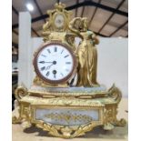 A 19th century French mantel clock in ornate gilt metal case depicting a female figure, with drum